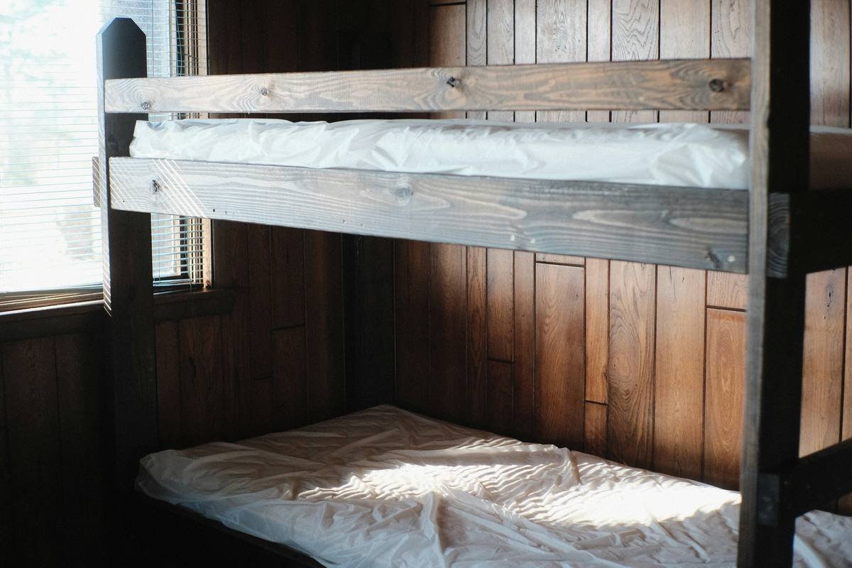 Infographic showing square footage saved by bunk beds vs. two twin beds in a 10x12 room