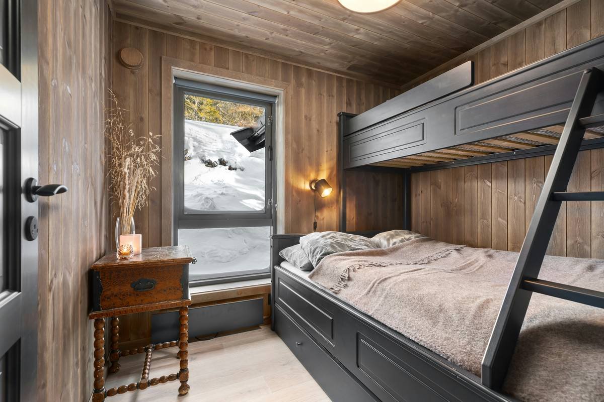 Stylish bunk beds for girls bedroom in neutral tones with fairy lights and bedding